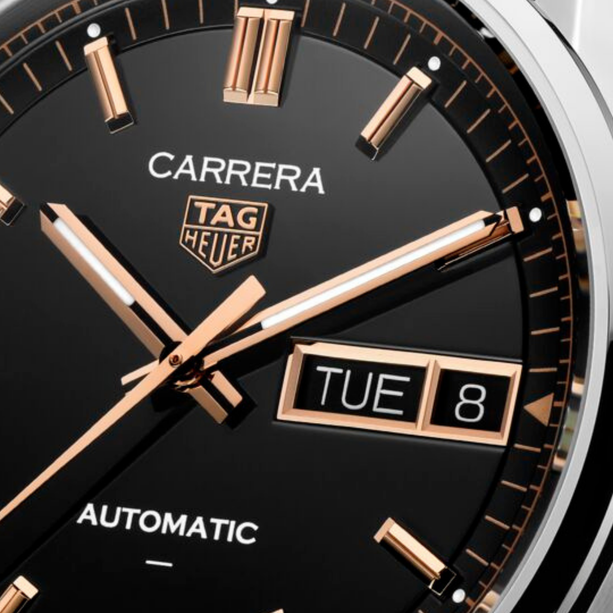 close-up of the black dial highlighting the smooth finish, rose gold-tone indices, day-date window and refined handset