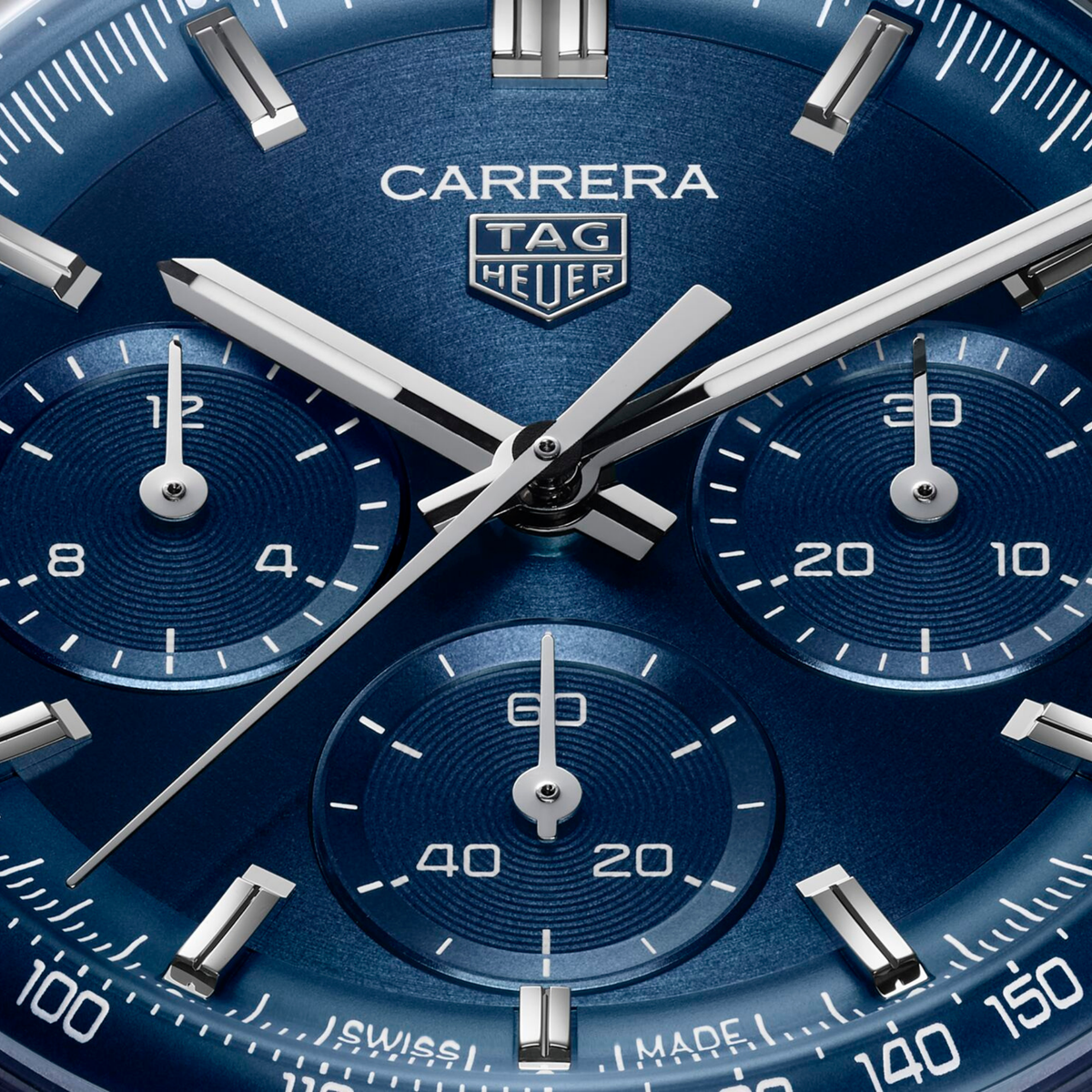 close-up of the blue dial highlighting the sunray finish, chronograph sub-dials, applied indices and detailed minute track