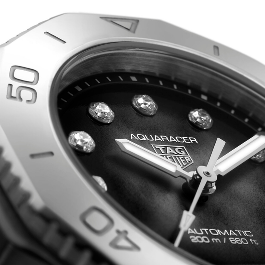 full view of TAG Heuer Aquaracer showcasing the polished and brushed steel bracelet and sporty case design