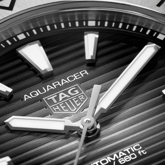 full view of the TAG Heuer Aquaracer highlighting the brushed and polished steel bracelet and robust, angular case profile