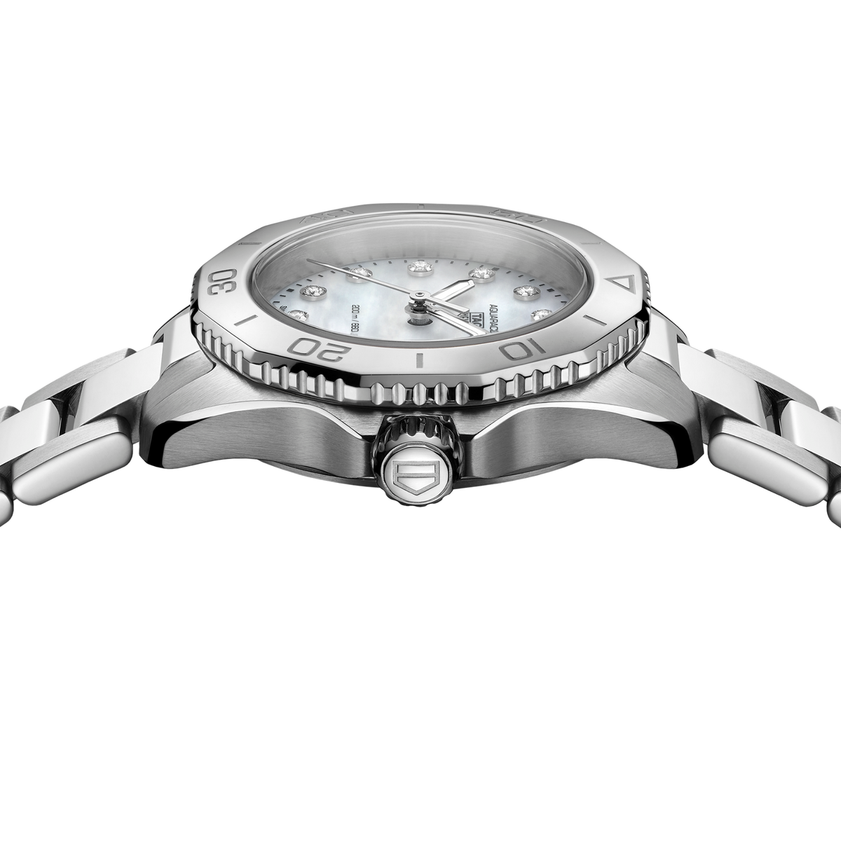 close-up of the mother-of-pearl dial showcasing the diamond-set markers, luminous hands and subtle natural texture