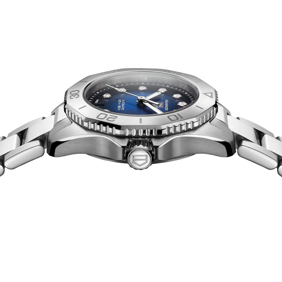 close-up of the blue dial highlighting the wave-like texture, diamond markers and date window