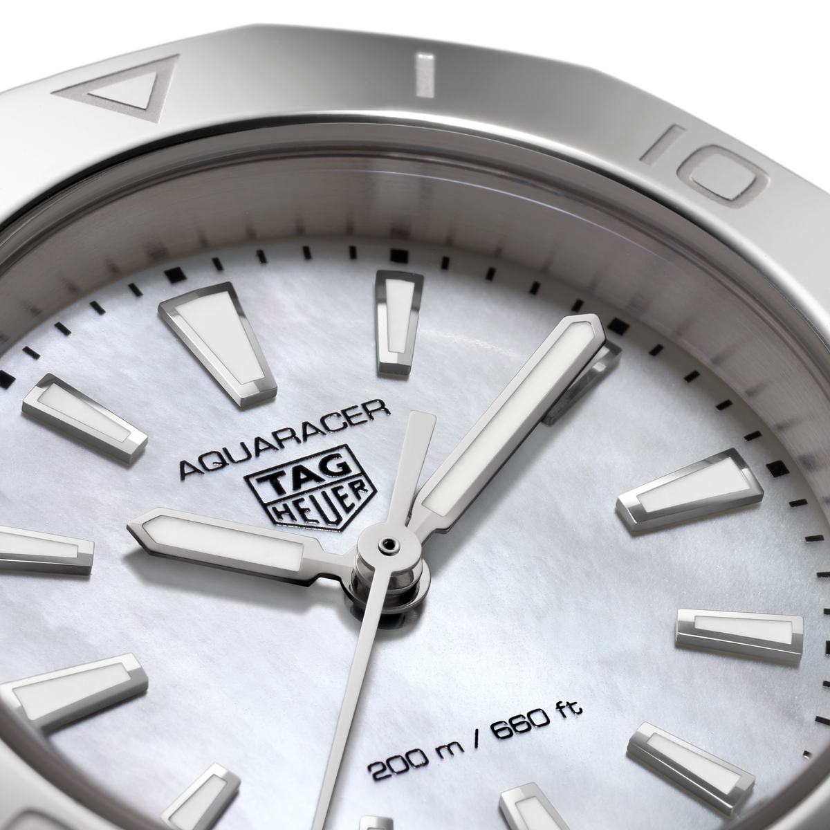 full view of the TAG Heuer Aquaracer showcasing the brushed and polished steel bracelet and sporty case proportions