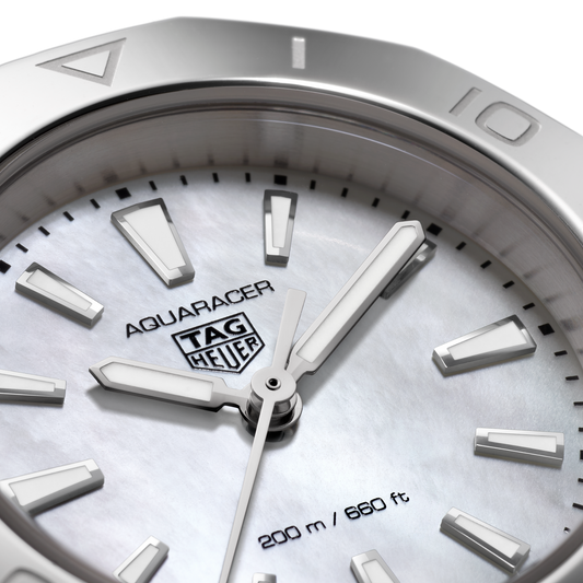 full view of the TAG Heuer Aquaracer showcasing the brushed and polished steel bracelet and sporty case proportions