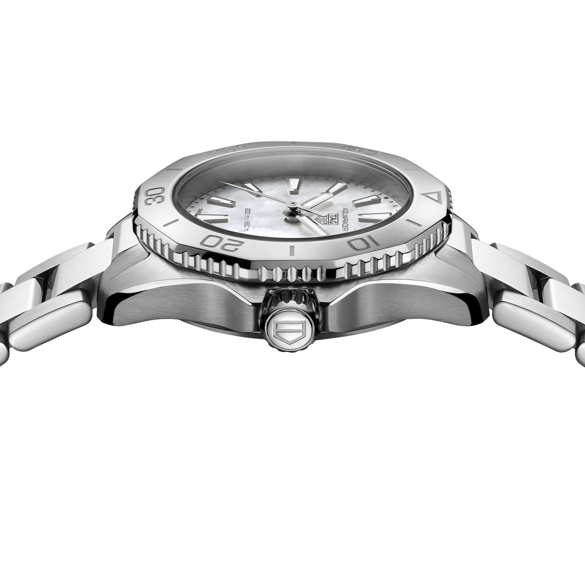close-up of the white mother-of-pearl dial highlighting the natural texture, luminous markers and clean layout