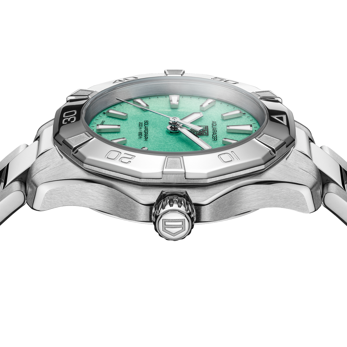 close-up of the green dial showcasing the luminous hour markers, bold handset and date window at 3 o’clock