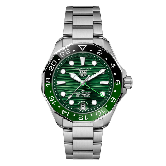 TAG Heuer Aquaracer GMT green dial watch featuring a striking wave-pattern green dial, bold luminous hour markers, and a bi-colour 24-hour bezel for tracking a second time zone, finished with a stainless steel bracelet
