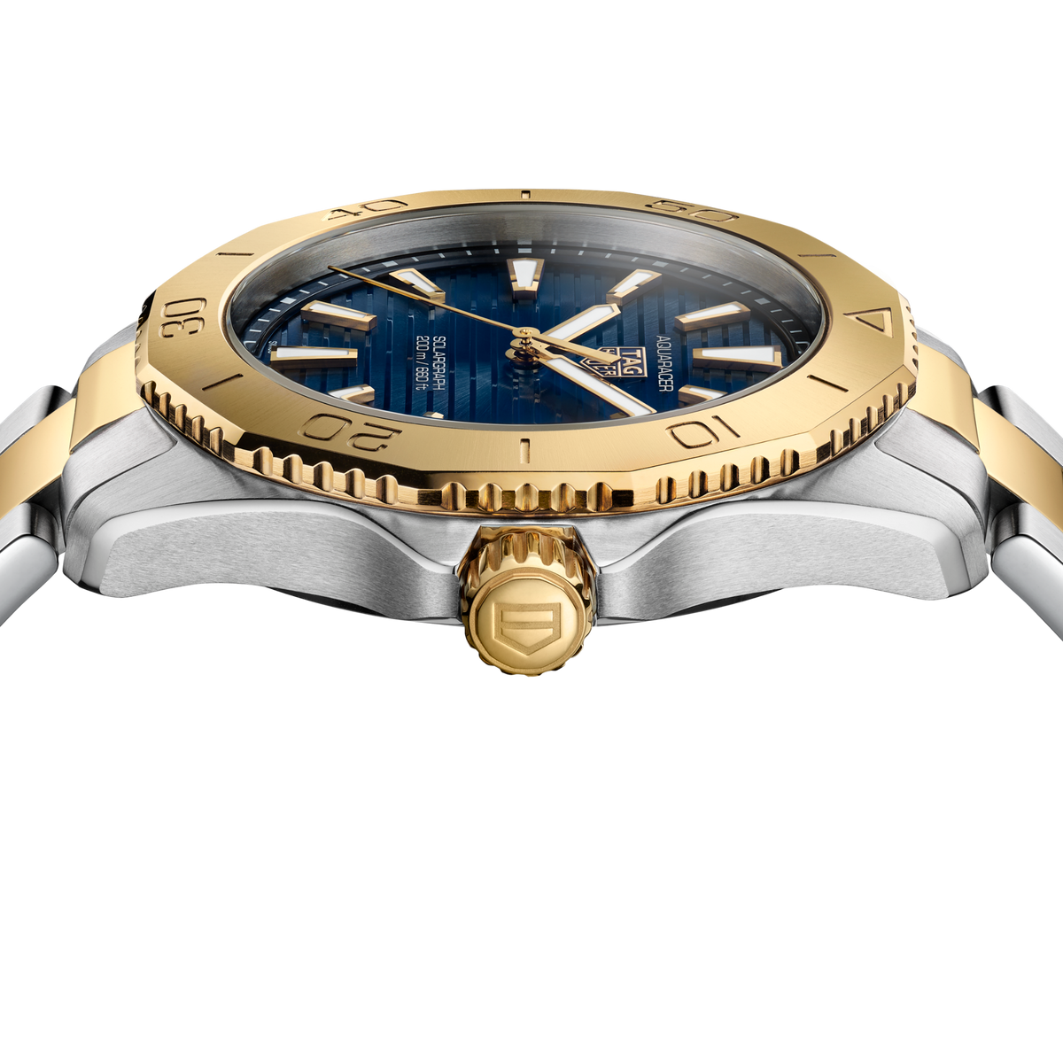 detailed view of the gold-tone unidirectional bezel with engraved numerals and dive scale markings for precise timing functionality