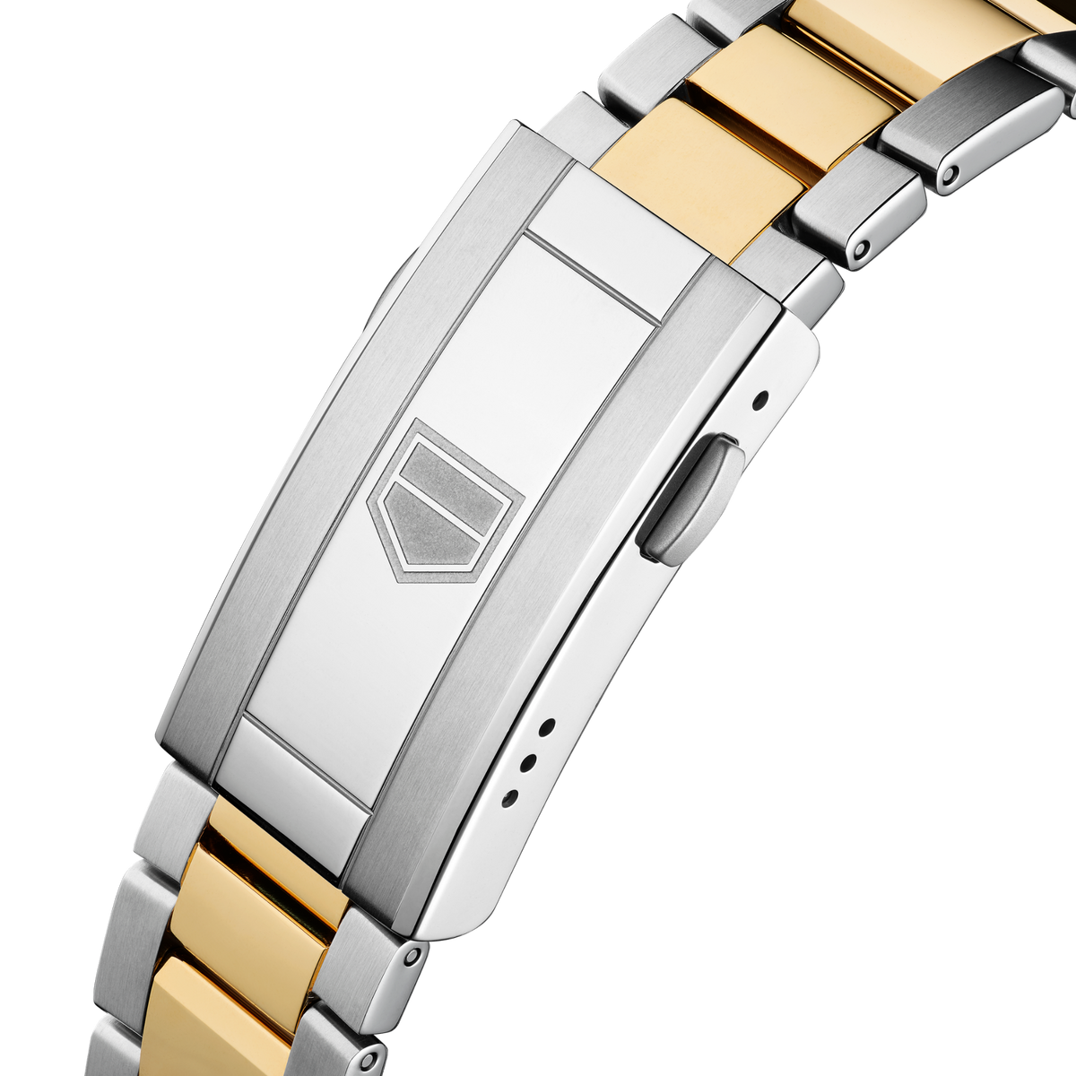 full view of the Aquaracer highlighting the two-tone bracelet, bold gold bezel and robust, angular case design