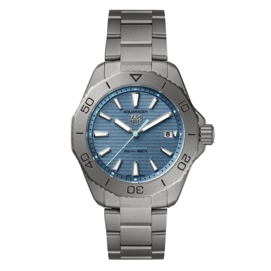 TAG Heuer Aquaracer Solargraph blue dial watch featuring a horizontally brushed light blue dial, luminous baton hour markers, date window at 3 o’clock, and a robust sandblasted-style steel case with matching bracelet