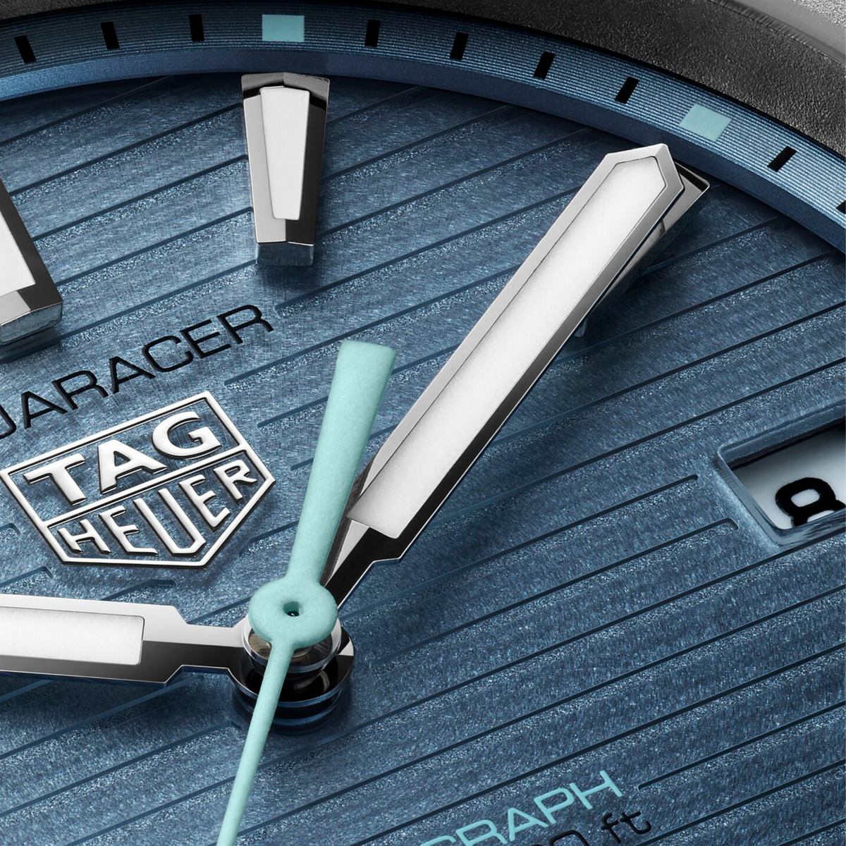 close-up of the textured blue dial, highlighting the horizontal lines, bold applied indexes, and contrasting hands designed for clear, everyday legibility
