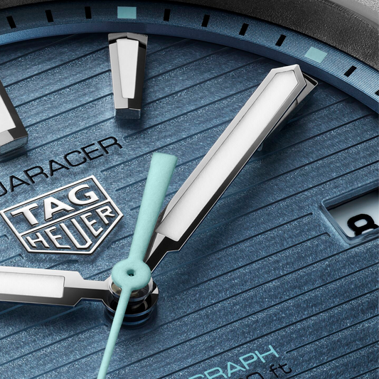 close-up of the textured blue dial, highlighting the horizontal lines, bold applied indexes, and contrasting hands designed for clear, everyday legibility