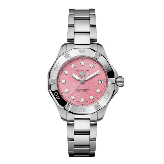 TAG Heuer Aquaracer Solargraph watch with pink textured dial, diamond hour markers, date window at 3 o’clock, steel bezel with black accents, and stainless steel bracelet