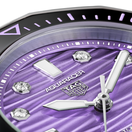 full view of the TAG Heuer Aquaracer highlighting the brushed steel bracelet and strong, angular case design