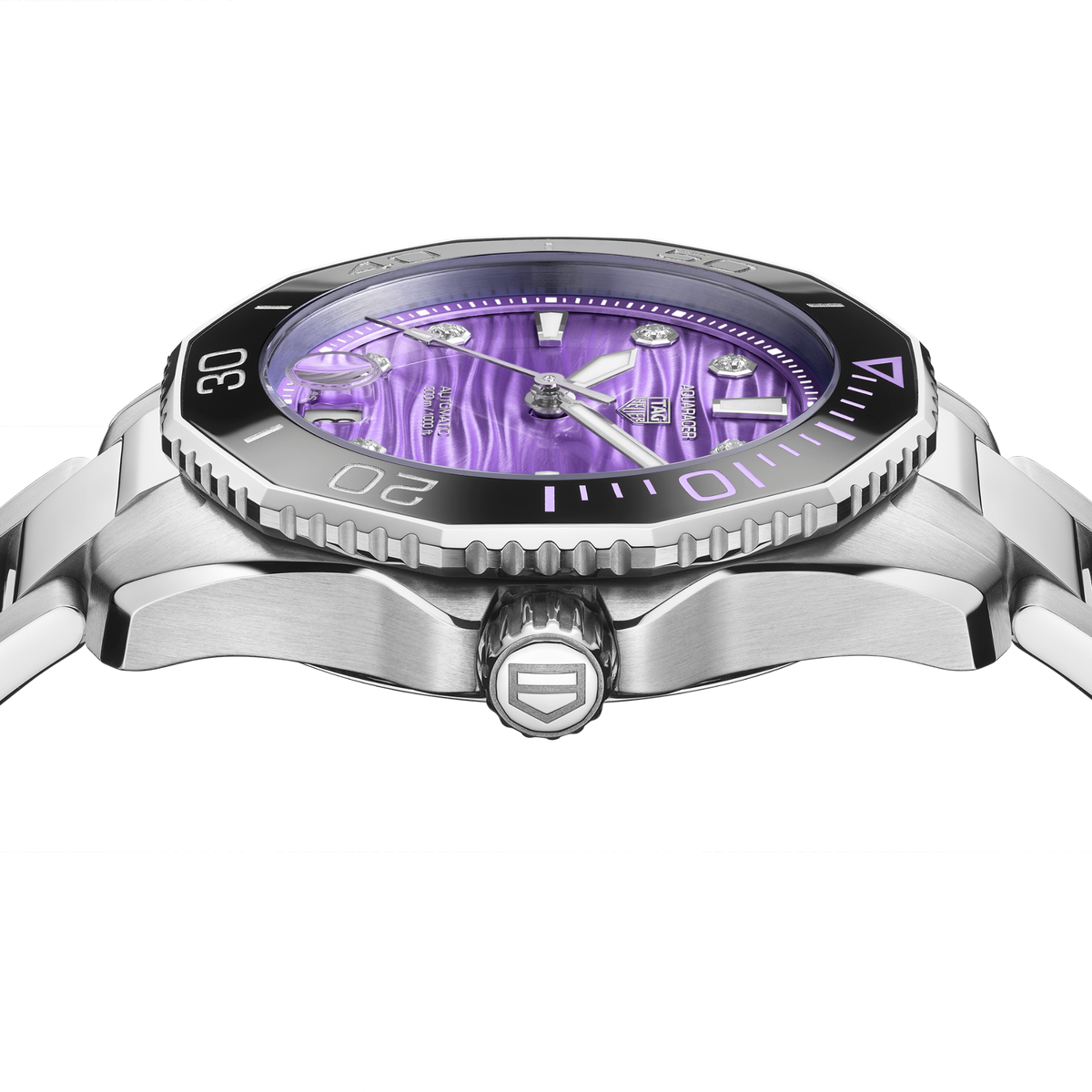 close-up of the purple dial showcasing the wave texture, diamond-set markers, luminous hands and magnified date window