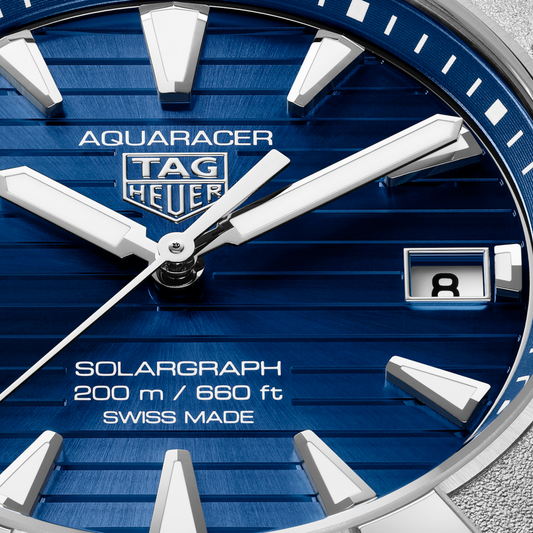 TAG Heuer Aquaracer Professional 200 Solargraph featuring a vibrant blue dial, luminous markers and polished stainless steel bracelet.