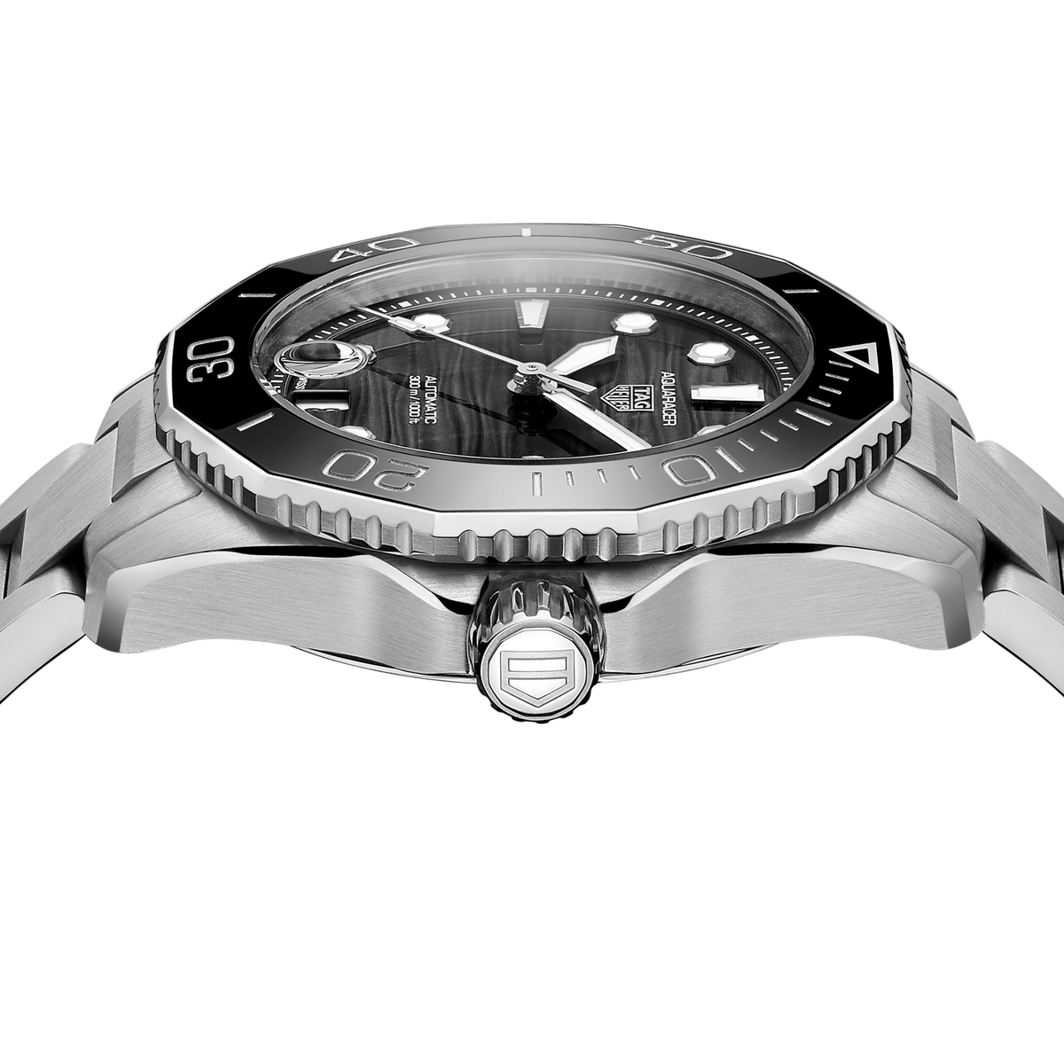 close-up of the black dial showcasing the horizontal texture, luminous markers, hands and magnified date window
