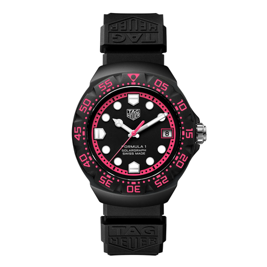 TAG Heuer Formula 1 Solargraph watch with black dial, bold pink accents, luminous hour markers, date window at 3 o’clock, and black rubber strap