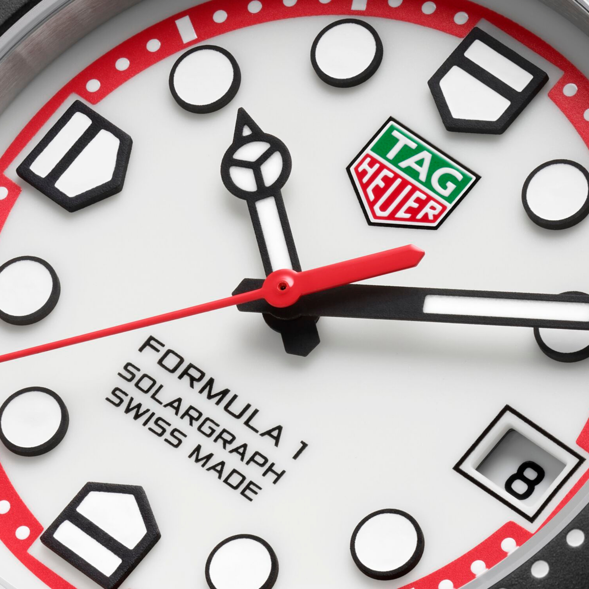 close-up of the white dial highlighting the vivid red flange, high-contrast markers, and sporty red seconds hand for enhanced legibility