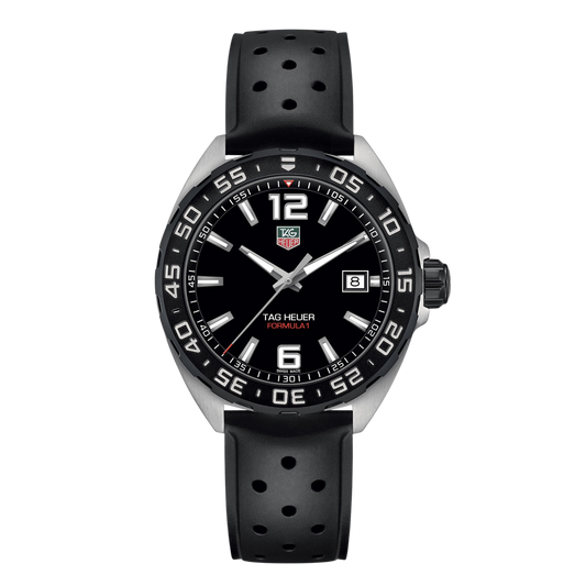 TAG Heuer Formula 1 watch with black dial, bold Arabic numerals at 12 and 6, white hour markers, date window at 3 o’clock, and perforated black rubber strap