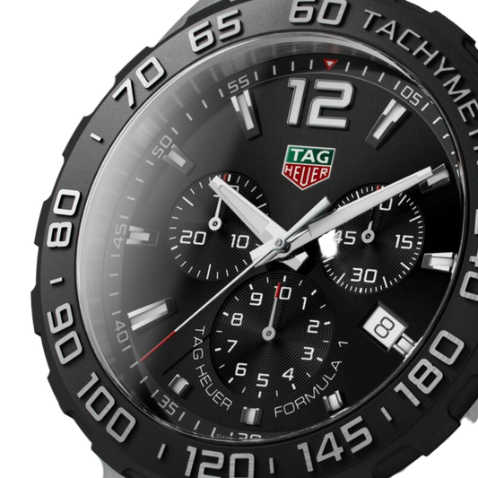 close-up of the black dial highlighting the tri-compax chronograph layout, subtle red accents, and bold hands and markers for precise readability