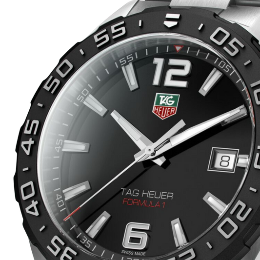 Tag Heuer watch with black dial and silver accents on a white background