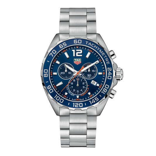 TAG Heuer Formula 1 chronograph watch with blue dial, three sub-dials, blue tachymetre bezel, orange accents, date window at 4 o’clock, and stainless steel bracelet