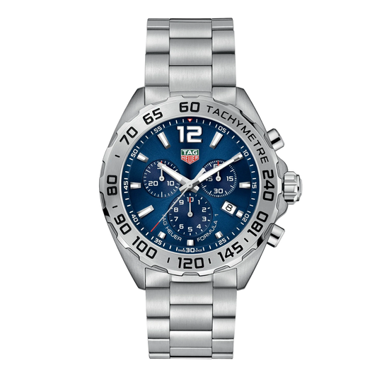 TAG Heuer Formula 1 chronograph watch with blue dial, three sub-dials, engraved tachymetre bezel, date window at 4 o’clock, and stainless steel bracelet