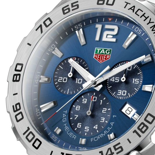 close-up of the blue dial highlighting the tri-compax chronograph layout, contrasting sub-dials, and red accent on the seconds hand for sporty clarity