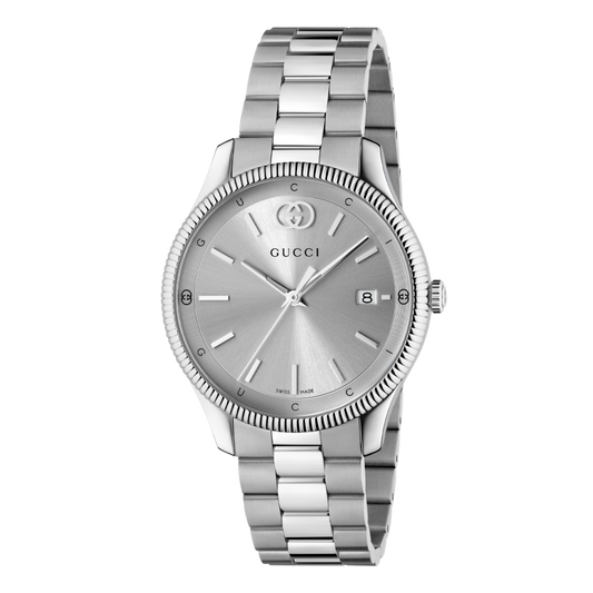 Gucci stainless steel watch with a silver sunray dial, fluted bezel, date display, and brushed stainless steel bracelet shown in full front view

