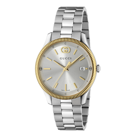 Gucci stainless steel watch with a silver sunray dial, gold fluted bezel, date display, and brushed stainless steel bracelet shown in full front view