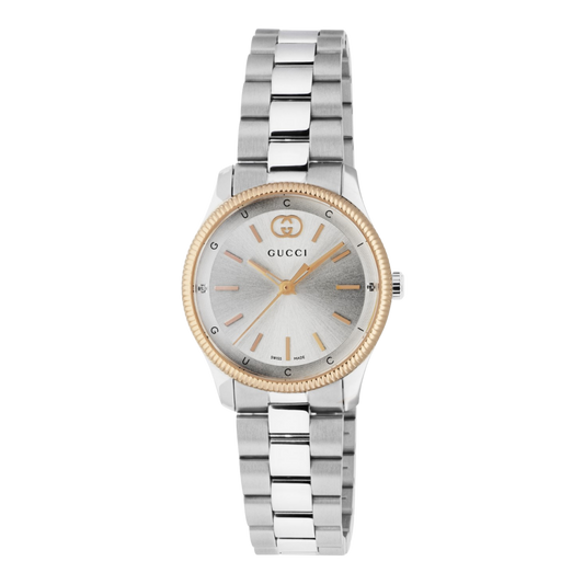Gucci stainless steel watch with a silver sunray dial, yellow gold-tone bezel, and minimalist baton hour markers shown in full front view