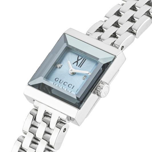 side profile of the Gucci watch highlighting the slim square case, polished stainless steel bracelet links, and elegant jewellery-inspired silhouette
