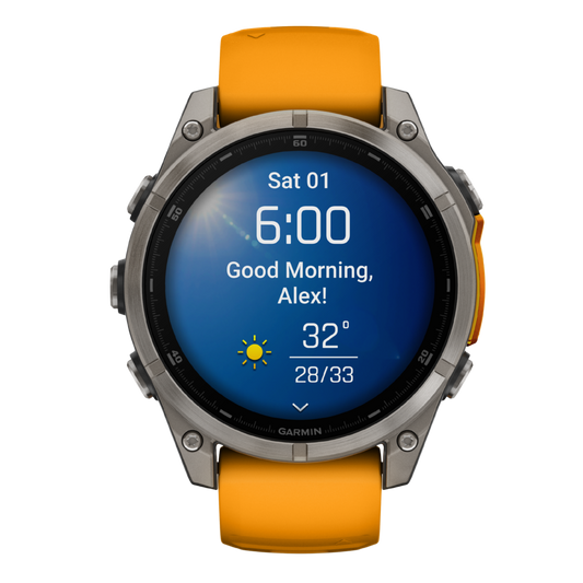 Garmin Fenix multisport GPS smartwatch with bright orange performance strap, rugged titanium-style case, and full-colour training metrics display shown in angled front view