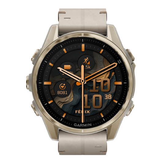 Garmin Fenix multisport GPS smartwatch with cream performance strap, gold-tone case, and advanced fitness dashboard display shown in angled front view