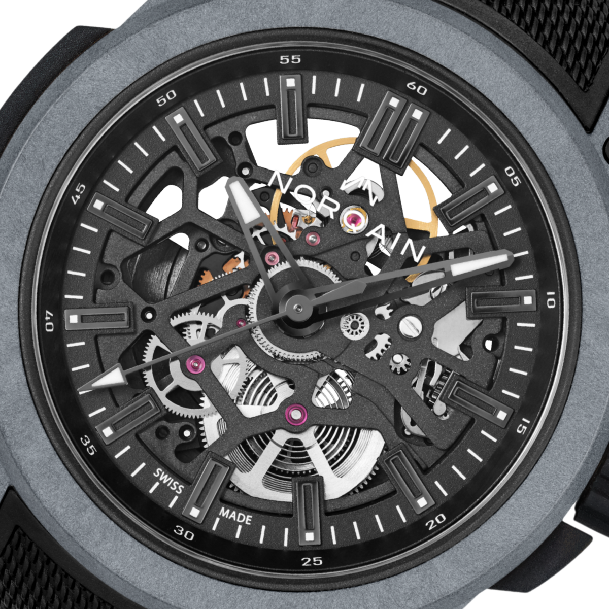 Close-up of the Norqain skeleton dial sports watch showcasing exposed mechanical components, monochrome grey detailing, lightweight case construction and modern technical styling.

