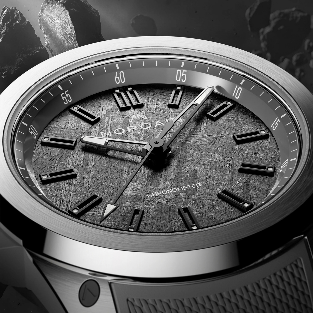 The anthracite dial is crafted from genuine iron meteorite discovered in northern Sweden, with its naturally formed Widmanstätten pattern ensuring every dial has an individual appearance.