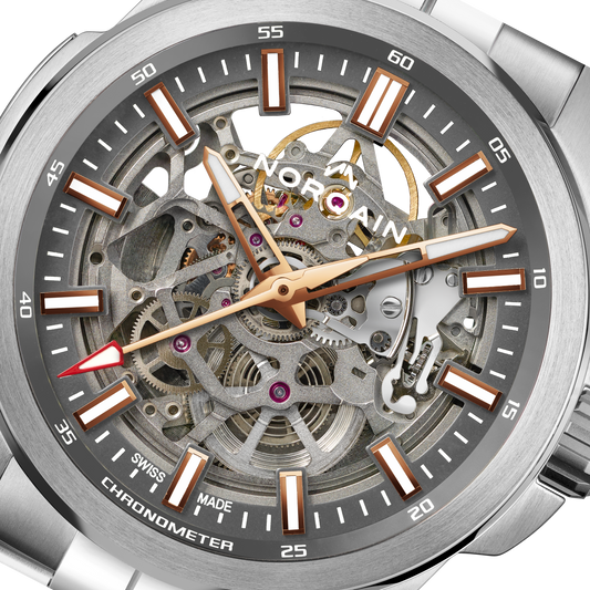 Close-up detail of the Norqain Independence Skeleton Chronometer featuring the intricate open-worked movement, visible gears and jewels, rose gold-tone accents and Swiss-made mechanical craftsmanship.