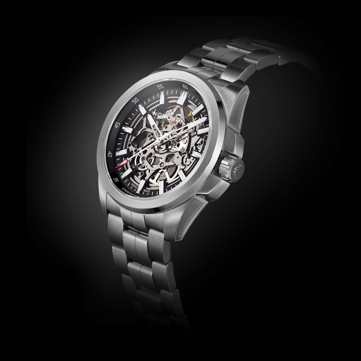 Angled view of the Norqain Independence Skeleton Automatic Watch showcasing the exposed mechanical movement, grey chapter ring, luminous rose gold-tone markers and integrated stainless steel bracelet.