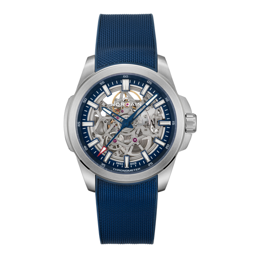Front view of the Norqain Independence Skeleton Blue Watch featuring an open-worked skeleton dial, blue chapter ring, blue hands, visible automatic movement and textured blue rubber strap.