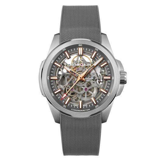 Front view of the Norqain Independence Skeleton Grey Watch featuring an open-worked skeleton dial, grey chapter ring, rose gold-tone hands and markers, and a textured grey rubber strap.