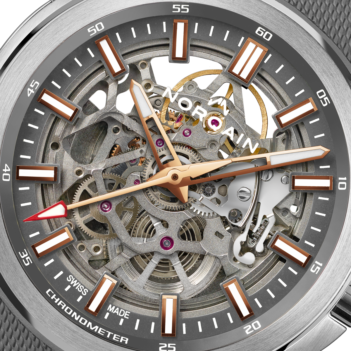 Close-up detail of the Norqain Independence Skeleton Grey Dial Watch featuring the intricate open-worked movement, visible gears and jewels, rose gold-tone accents, chronometer certification and Swiss-made mechanical craftsmanship.