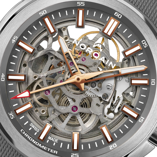 Close-up detail of the Norqain Independence Skeleton Grey Dial Watch featuring the intricate open-worked movement, visible gears and jewels, rose gold-tone accents, chronometer certification and Swiss-made mechanical craftsmanship.