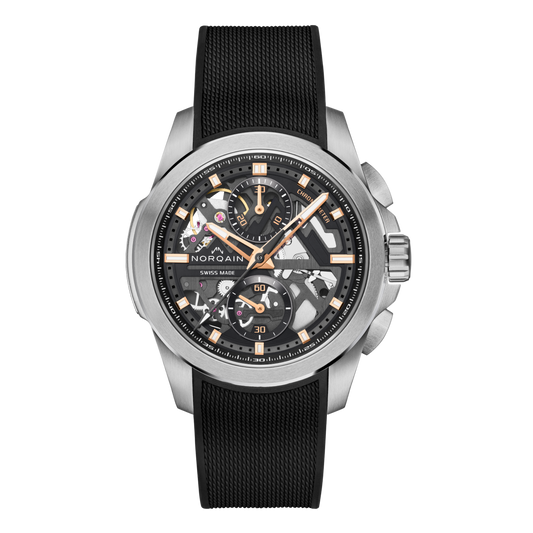 Front view of the Norqain Independence Skeleton Chronograph Watch featuring a black open-worked dial, visible mechanical movement, rose gold-tone accents and a black textured rubber strap.