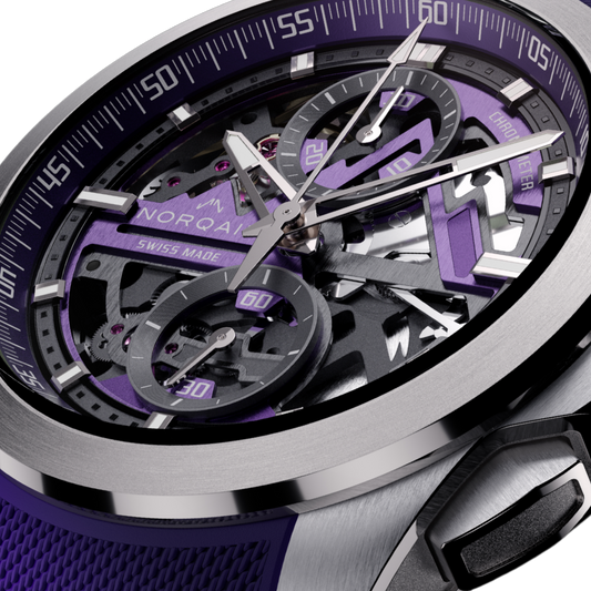 Close-up of the Norqain skeleton chronograph showcasing visible gears, purple chronograph sub-dials, stainless steel case and sporty textured rubber strap design.