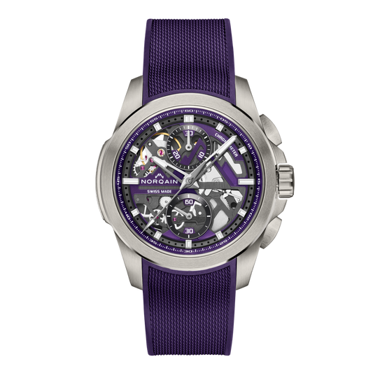 Front view of the Norqain Freedom Skeleton Chronograph Watch featuring a striking purple open-worked dial, exposed Swiss mechanical movement and matching purple rubber strap.