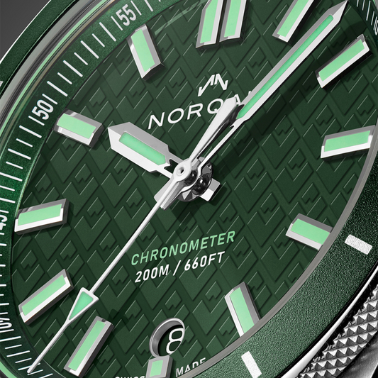 Side profile of the Norqain Adventure Sport Automatic Watch highlighting the stainless steel bracelet, screw-down crown, robust case construction and sporty everyday design.
