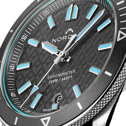 NORQAIN Adventure 40mm Swiss automatic watch featuring a grey mountain dial, steel case and integrated stainless steel bracelet