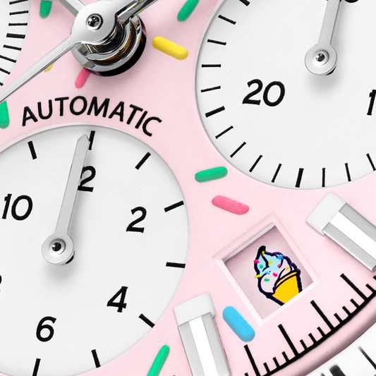 Bright and expressive, this 40mm NORQAIN chronograph brings together a pink “Enjoy Life” dial and sporty steel case. It’s designed to stand out while staying practical for everyday wear.
