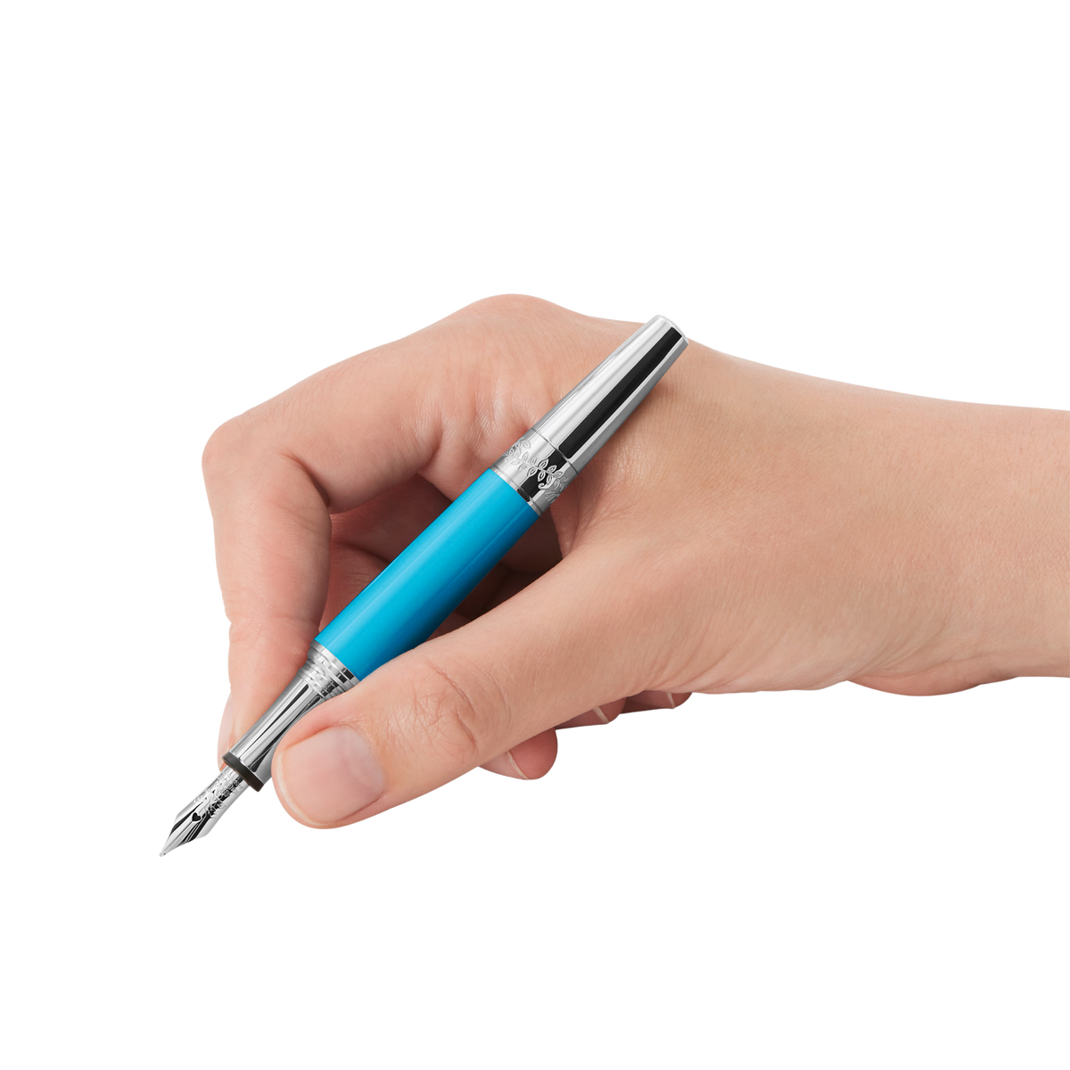 Hand writing with the Montblanc Great Characters Maria Callas Special Edition turquoise fountain pen.